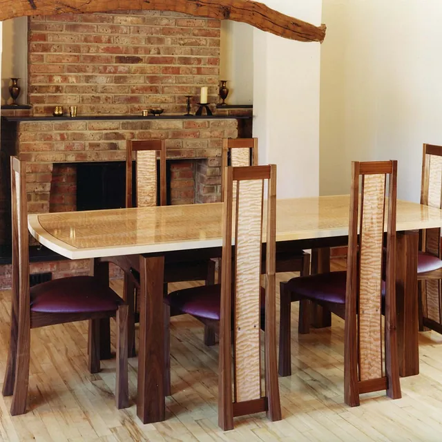 wooden desk and wooden chairs with a purple seat